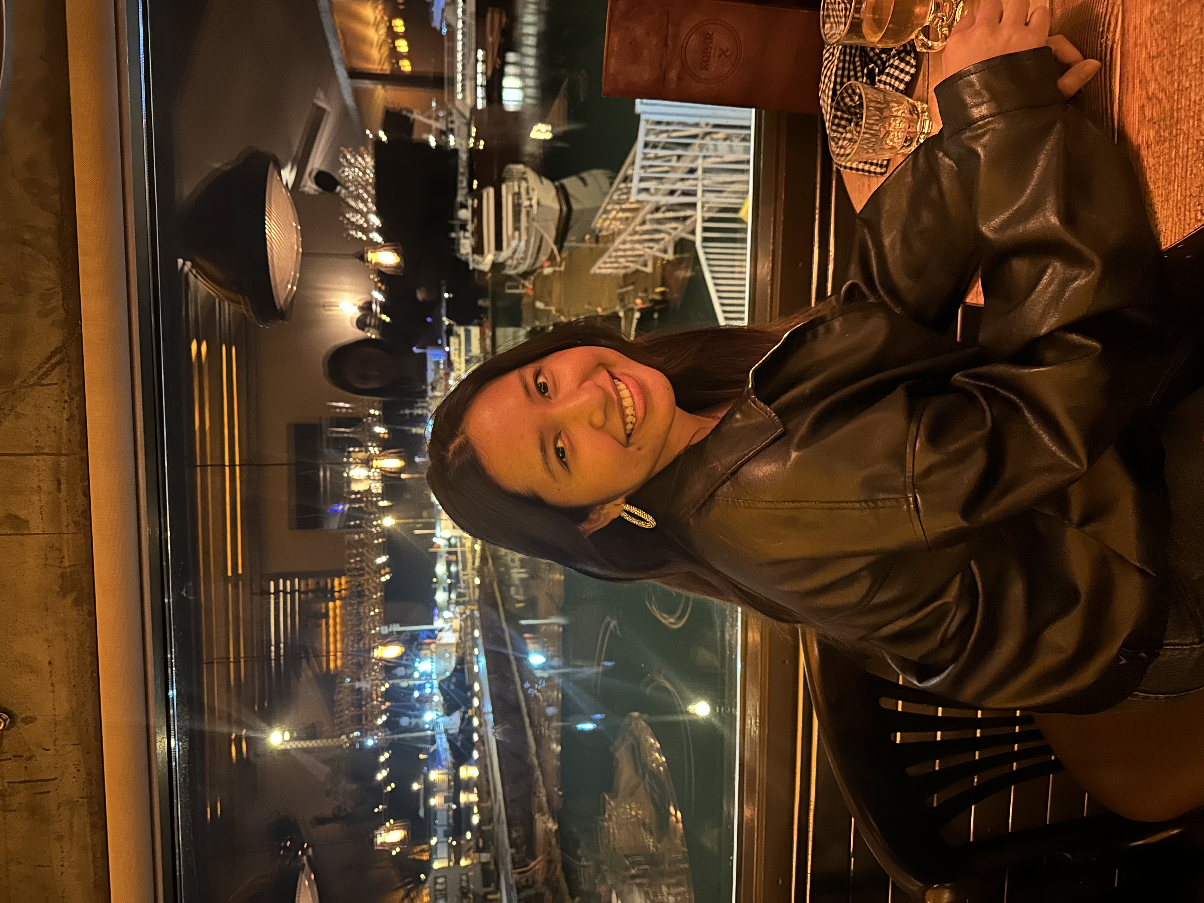 Zelan smiling in a café